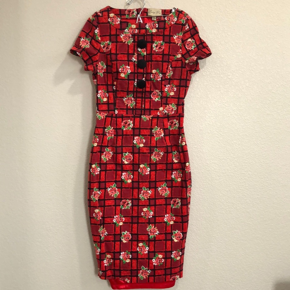 Lindy bop red pencil dress with black button detail.